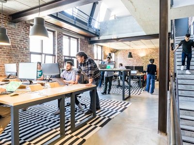 Modern office workspace where hiring delays create engineering team productivity challenges
